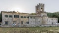 The beautiful Abbey of San Lorenzo in Coltibuono with the sun setting in the background, Tuscany, Italy Royalty Free Stock Photo