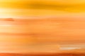 Beautiful abstract gradient background of warm colors and shades of yellow orange red. Paintbrush strokes on textured canvas Royalty Free Stock Photo