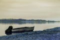 Beautiful abstract landscape. Boat on the banks of a large river.