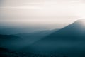 A beautiful, abstract monochrome mountain landscape in blue tonality.