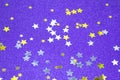 Beautiful abstract purple or magenta glitter background with stars confetti gold and silver Royalty Free Stock Photo