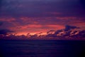 Beautiful abstract seascape sunset, pink and purple tones, beautiful clouds shapes Royalty Free Stock Photo