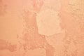 Beautiful abstract texture decorative wall colored in Peach Fuzz, grungy stucco. Background with copy space. Concept of Royalty Free Stock Photo