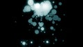 Beautiful abstraction of large and small shimmering colorful particles rotating and falling down on the black background