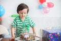 Beautiful adorable four year old boy in green shirt, celebrating Royalty Free Stock Photo