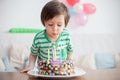 Beautiful adorable four year old boy in green shirt, celebrating Royalty Free Stock Photo