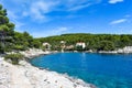 Beautiful Adriatic sea in Croatia. Blue lagoon  green pines  stony coast. Footpath along the sea.Bright landscape Royalty Free Stock Photo