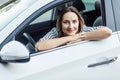 Beautiful adult business woman sitting a car, looking at camera Royalty Free Stock Photo