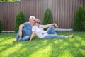 Portrait of happy of middle aged couple on a green grass Royalty Free Stock Photo