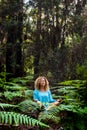 Beautiful adult lady do mindfulness exercises and yoga m editation sit down in the silence of the green nature forest - people Royalty Free Stock Photo