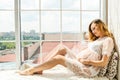 Beautiful adult pregnant woman. Waiting for the baby. Pregnancy. Care, tenderness, motherhood, childbirth. Royalty Free Stock Photo