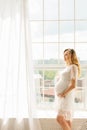 Beautiful adult pregnant woman. Waiting for the baby. Pregnancy. Care, tenderness, motherhood, childbirth. Royalty Free Stock Photo