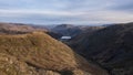 Beautiful aerial drone landscape image of sunrise Winter view from Red Screes in Lake District looking towards Brothers Water and Royalty Free Stock Photo