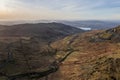 Beautiful aerial drone landscape image of sunrise Winter view from Red Screes in Lake District looking towards Windermere in the Royalty Free Stock Photo