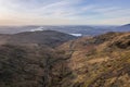 Beautiful aerial drone landscape image of sunrise Winter view from Red Screes in Lake District looking towards Windermere in the Royalty Free Stock Photo