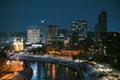 Beautiful aerial evening view of illuminated business district in Vilnius. Winter sunset in capital of Lithuania Royalty Free Stock Photo