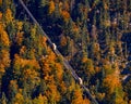 Beautiful aerial fall view of cable car ropeway funicular in austrian alps. Red cable railway car in the mountains Royalty Free Stock Photo