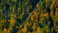 Beautiful aerial fall view of cable car ropeway funicular in austrian alps. Red cable railway car in the mountains by resort Royalty Free Stock Photo