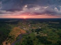 River on meadow under colorful evening sky Royalty Free Stock Photo