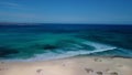 Beautiful aerial panning clip of Flag Beach and Isla de Lobos