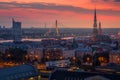 Beautiful aerial panorama of Riga center and Vansu bridge over Daugava river during amazing sunset. View of illuminated Riga city Royalty Free Stock Photo