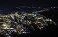 Beautiful aerial panoramic night view of town Fira, Santorini island, Cyclades in Greece Royalty Free Stock Photo
