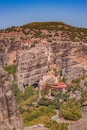 Beautiful aerial panoramic photo of the monasteries and rock formations of Meteora above Kalambaka city at sunset. Thessaly, Royalty Free Stock Photo