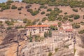 Beautiful aerial panoramic photo of the monasteries and rock formations of Meteora above Kalambaka city at sunset. Thessaly, Royalty Free Stock Photo