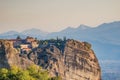 Beautiful aerial panoramic photo of the monasteries and rock formations of Meteora above Kalambaka city at sunset. Thessaly, Royalty Free Stock Photo