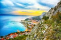 Beautiful aerial panoramic view of Cetina river, mountains and Old town Omis at sunset Royalty Free Stock Photo