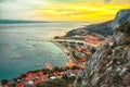 Beautiful aerial panoramic view of Cetina river, mountains and Old town Omis at sunset Royalty Free Stock Photo