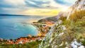 Beautiful aerial panoramic view of Cetina river, mountains and Old town Omis at sunset Royalty Free Stock Photo