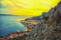 Beautiful aerial panoramic view of Cetina river, mountains and Old town Omis at sunset Royalty Free Stock Photo