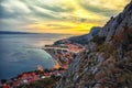 Beautiful aerial panoramic view of Cetina river, mountains and Old town Omis at sunset Royalty Free Stock Photo