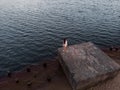 Lonely woman alone - Beautiful aerial Riga port and river Daugava lanscape shots from drone - Top view from above Royalty Free Stock Photo