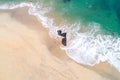 Beautiful aerial shot of a beach with nice sand and green turquoise water. Top view of a beach scene with a drone Royalty Free Stock Photo