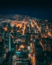 Beautiful aerial shot of the city of Chicago enveloped in fog during the night Royalty Free Stock Photo