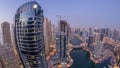 Beautiful aerial top view day to night transition of Dubai Marina canal Royalty Free Stock Photo