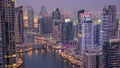 Beautiful aerial top view day to night transition of Dubai Marina canal Royalty Free Stock Photo