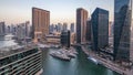 Beautiful aerial top view day to night transition timelapse of Dubai Marina canal Royalty Free Stock Photo