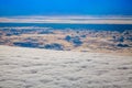 Beautiful aerial view above clouds with sunset. Airplane view concept travel
