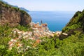 Beautiful aerial view of Atrani village between green branches and cliff rocks, Amalfi Coast, Italy Royalty Free Stock Photo