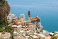 Beautiful aerial view of Atrani village between green branches and cliff rocks, Amalfi Coast, Italy Royalty Free Stock Photo