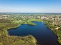 Beautiful aerial view of blue lake and green forest district in Royalty Free Stock Photo