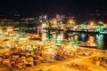 Beautiful aerial view of busiest Asian cargo port with hundreds of ships loading export and import goods and thousands