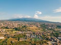 Beautiful aerial view on the Catania city with Etna volcano on the background by the sea.