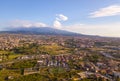 Beautiful aerial view on the Catania city with Etna volcano on the background by the sea.