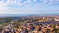 Beautiful aerial view on the Catania city with Etna volcano on the background by the sea.