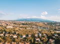 Beautiful aerial view on the Catania city with Etna volcano on the background by the sea.