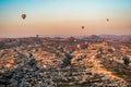 Beautiful aerial view of colorful hot air balloons flying over Cappadocia, Turkey. Royalty Free Stock Photo